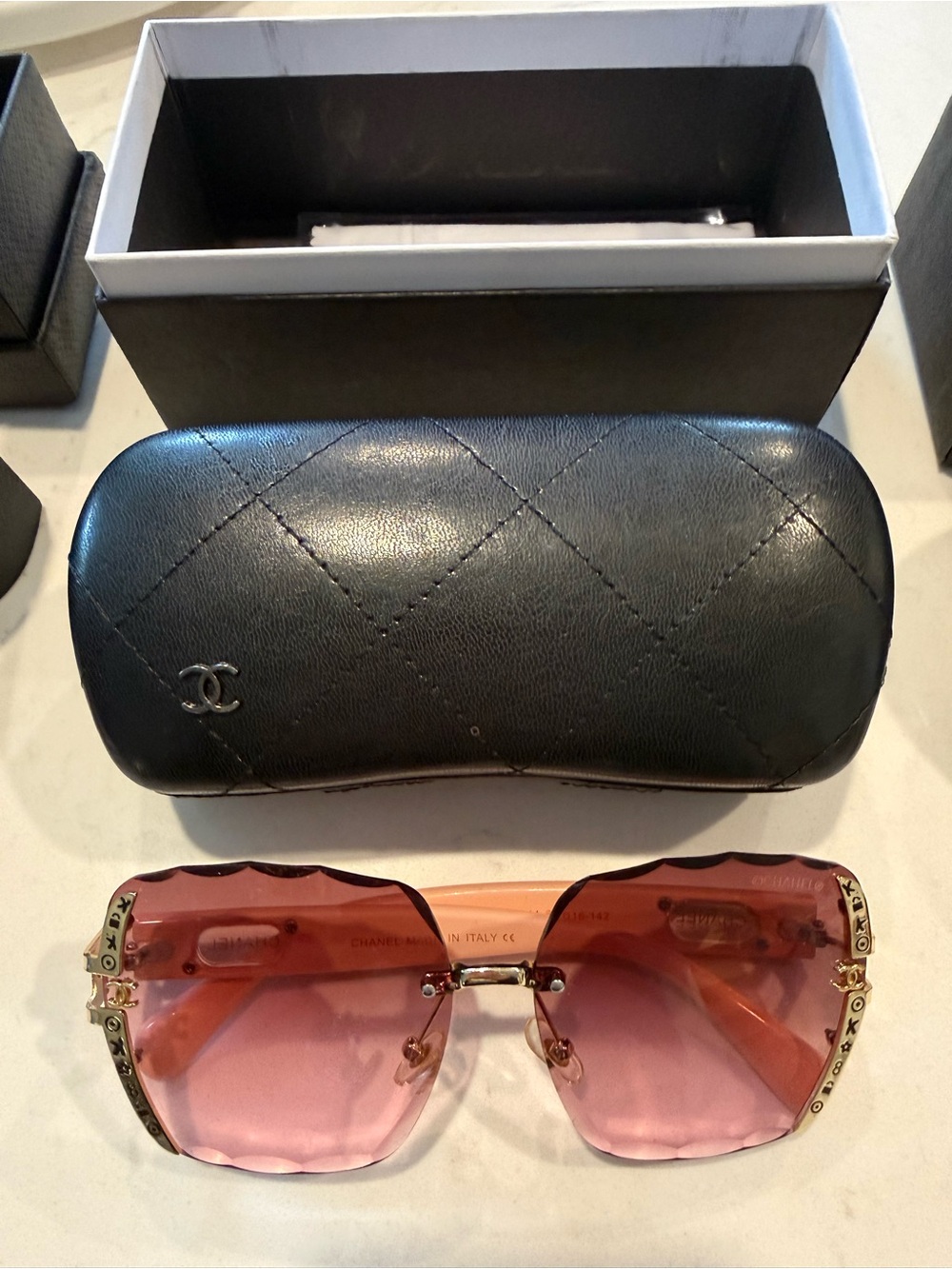 CHANEL Pink Rimless Sunglasses with Gold Accents and Black Quilted Case